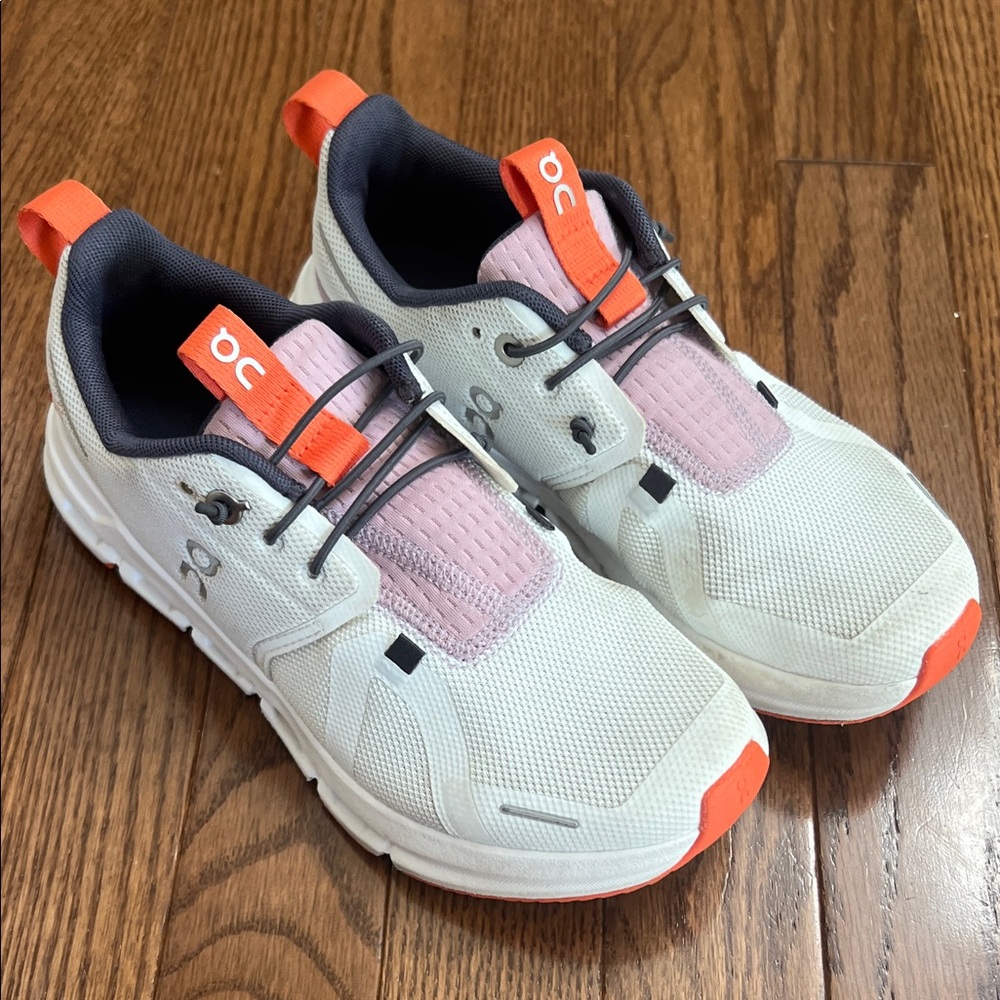 On Running White and Orange Sneakers with Modern Design